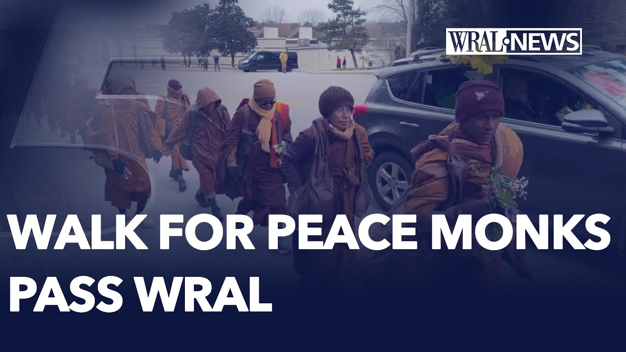 Monks on Walk For Peace pass WRAL Headquarters in Raleigh