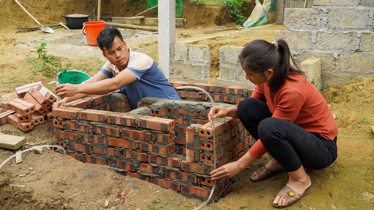 After a day off, Linh and Chung quickly finished building the septic tank for their house.