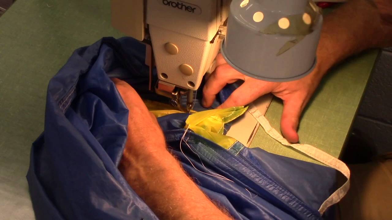 Patch into tail seam, non loaded rib and a line attachment point. Skydiving Services LLC