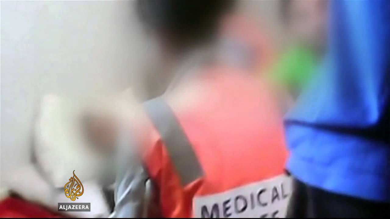 Asylum-seekers 'sew lips' at detention camp