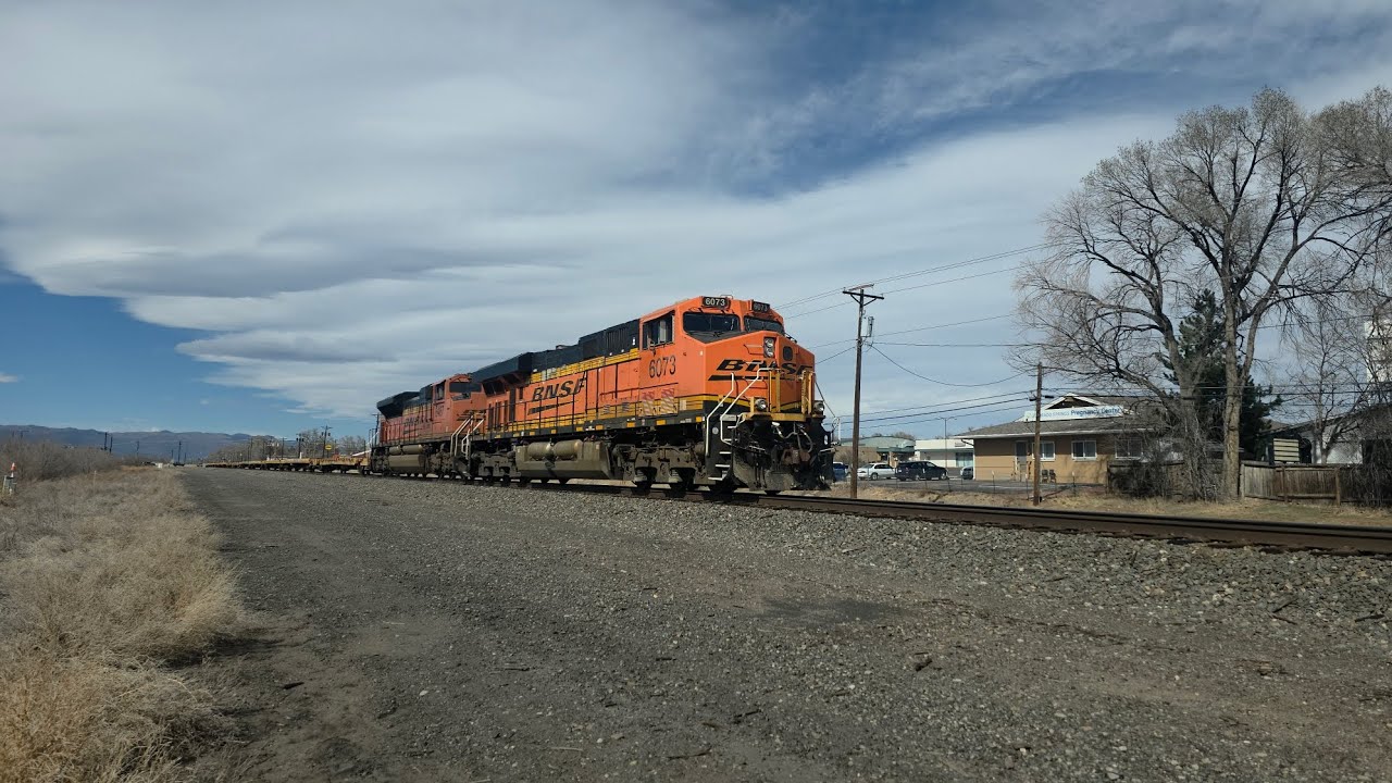 BNSF Flatcar train leaving Fort Carson and heading southbound 