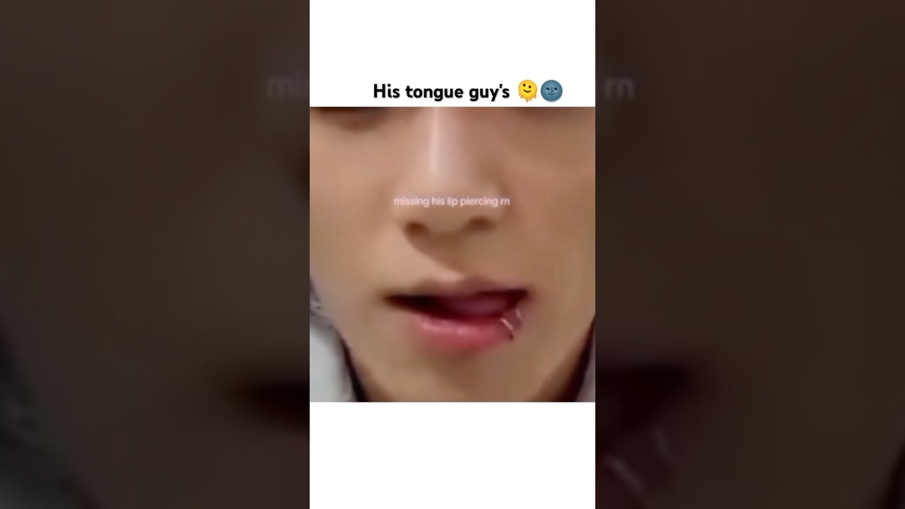 Jungkook playing with his lip piercing
