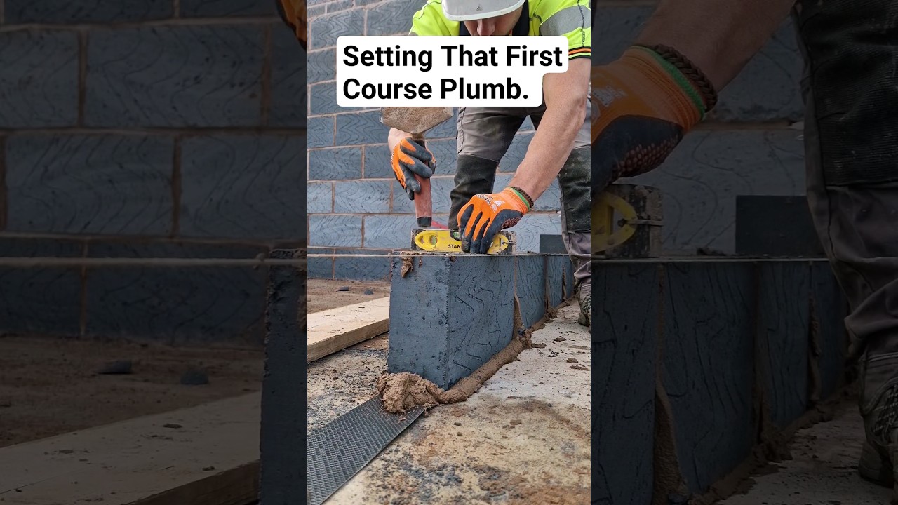 Level across the top of your block to make your wall go up straight #bricklayer #work #tips