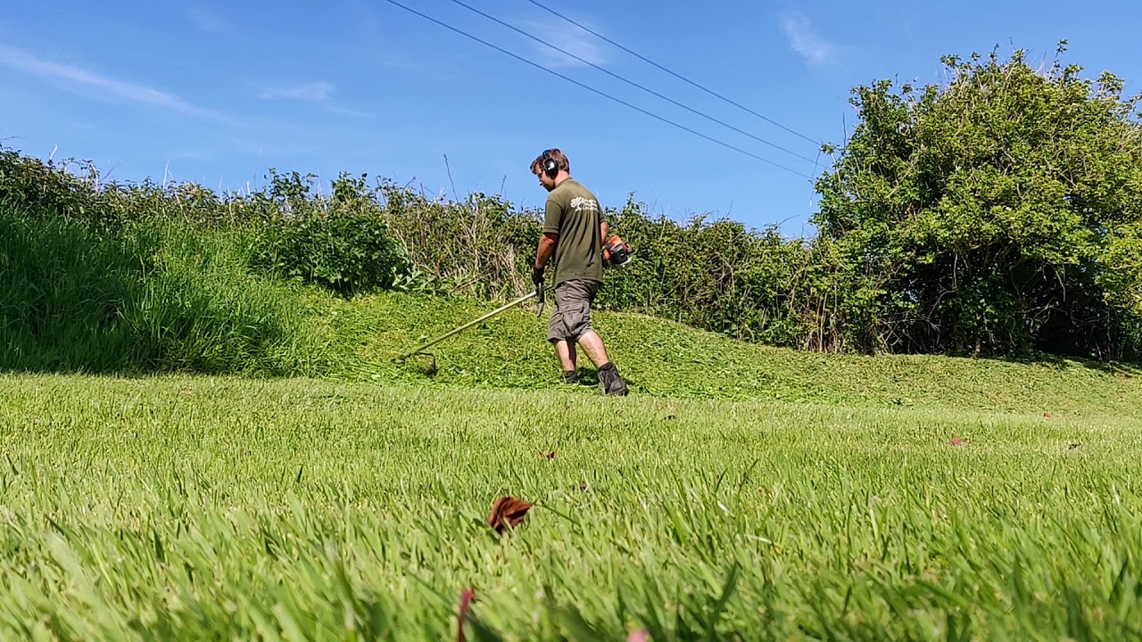 Strimming a bank. Husqvarna 525 RJX