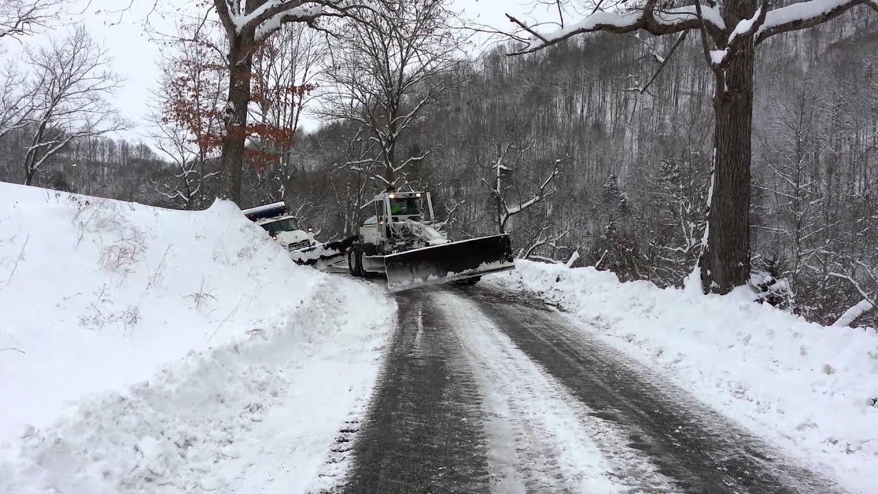 6x6 Grader Recovers Plow Truck