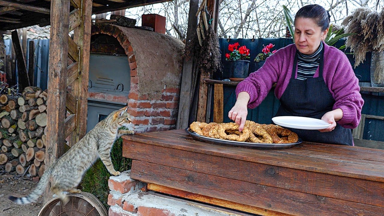 A Turkish rural family prepares Simit in a simple Turkish village far from civilization