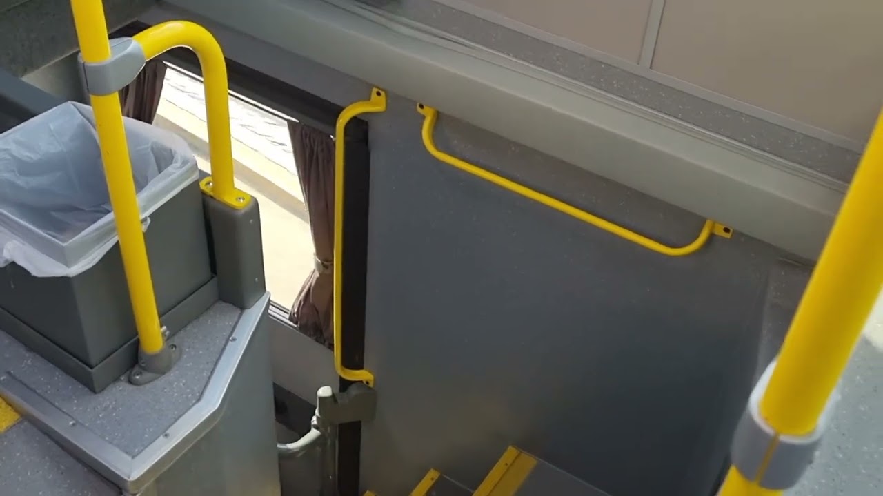 Getting off the rear door of a van hool TDX27 Astromega