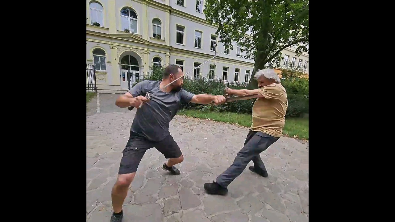 One take of swordfight choreography training with different weapons 