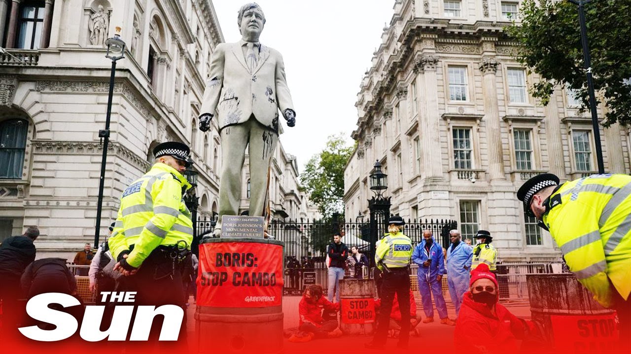 Boris Johnson statue covered in oil blocks Whitehall in eco-protest