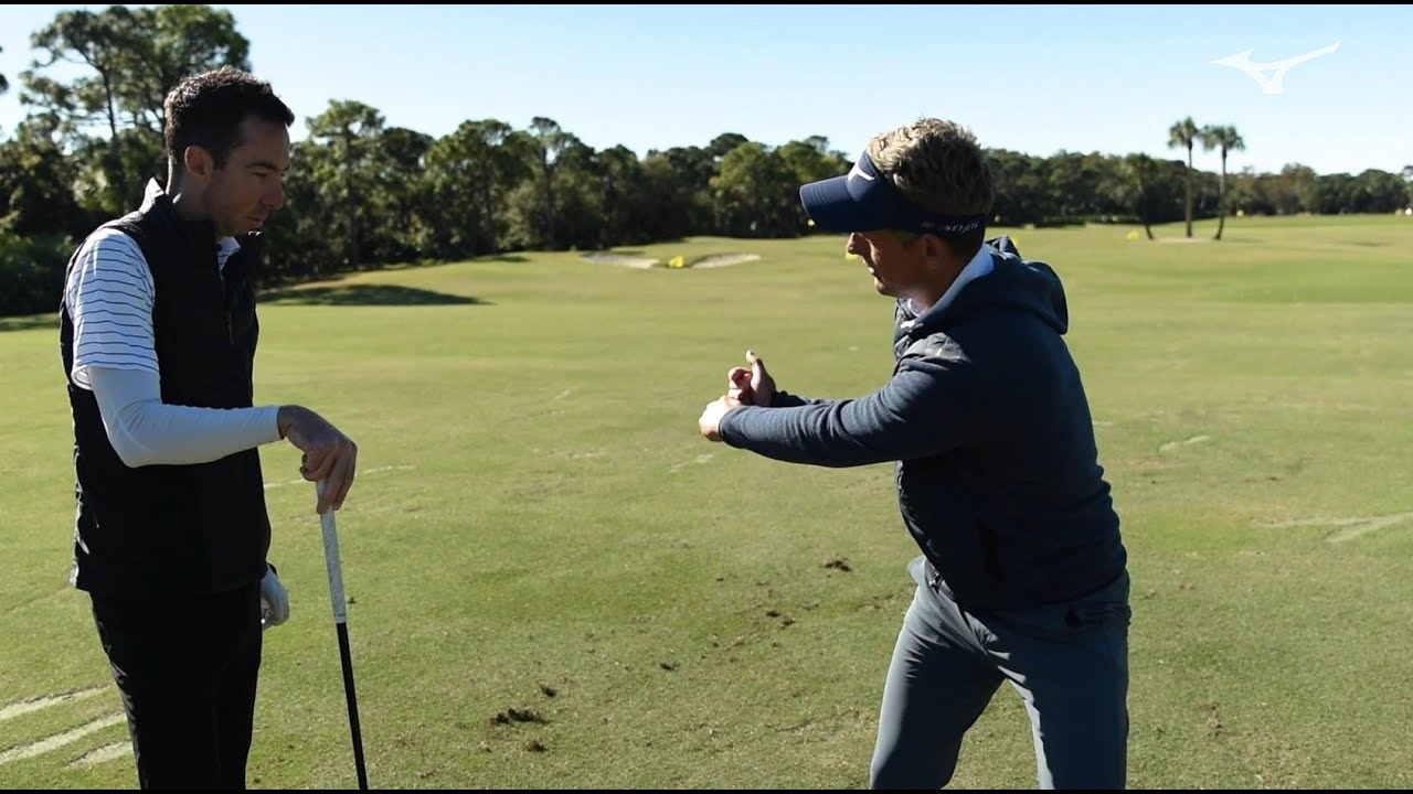 Mizuno on the range with Luke Donald and Chris Voshall