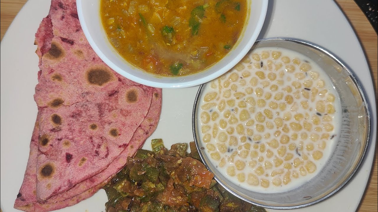 Lunch is served!! Beetroot ki roti daal bhindi and raita! 