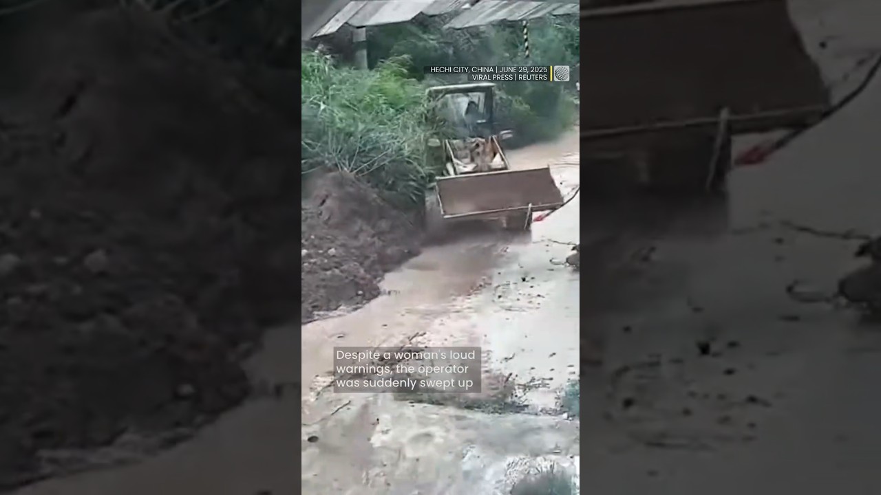 Heavy loader caught by landslide slammed into nearby building