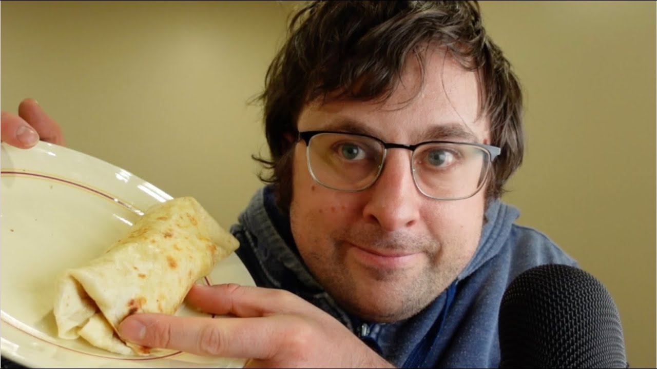 ASMR reading about Honduras, eating a wrap and apples, whispering