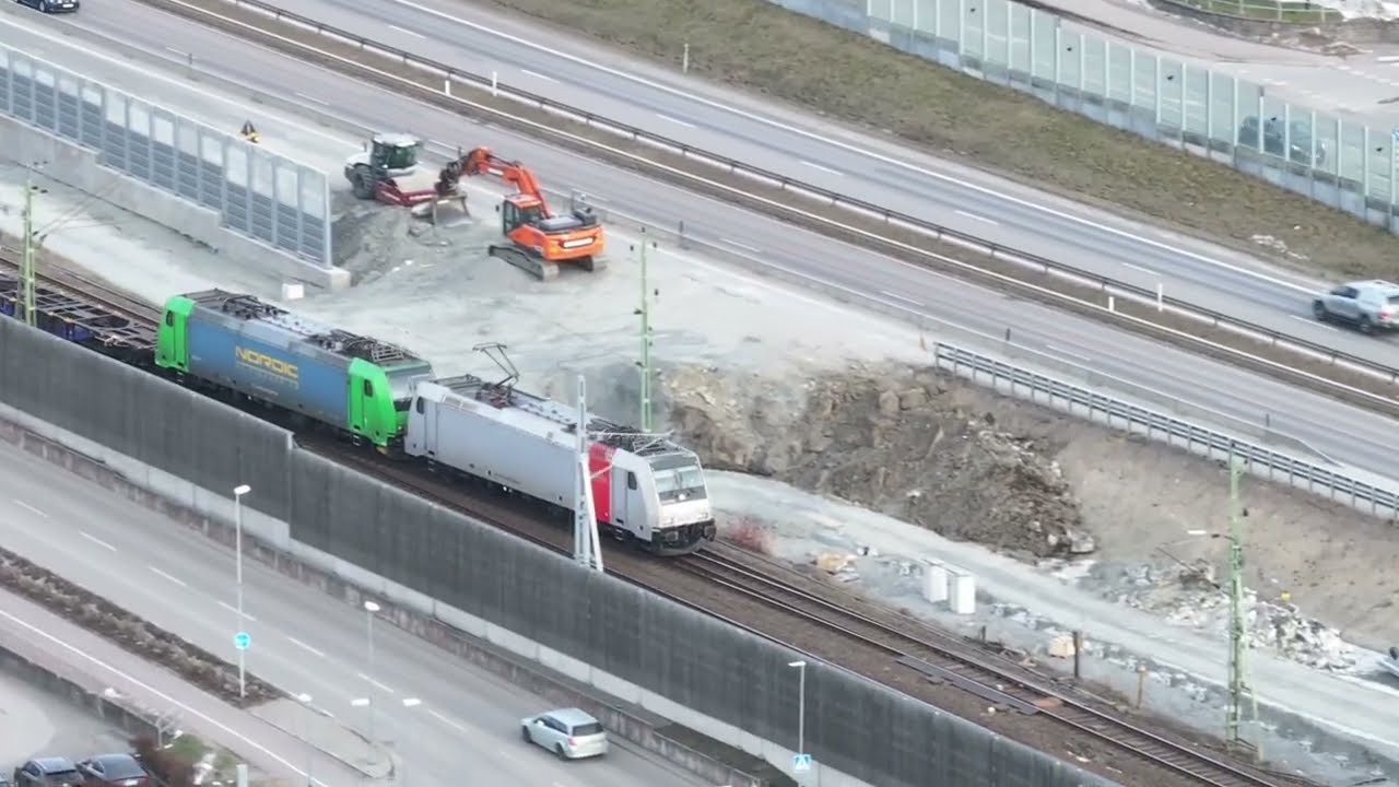 Drone, track work, single track and trains in Lerum. Text below.