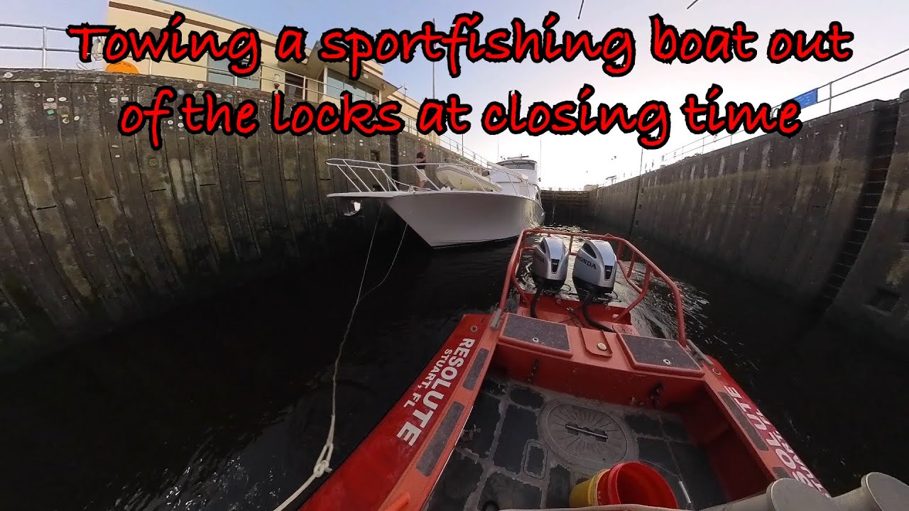 Towing a Viking Sport Fishing Boat Out of St Lucie Lock at Closing Time, Taking In Tow to a Marina