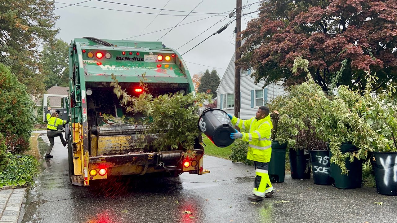 WM’s Green Blade Garbage Truck Packing Big Wet Trees