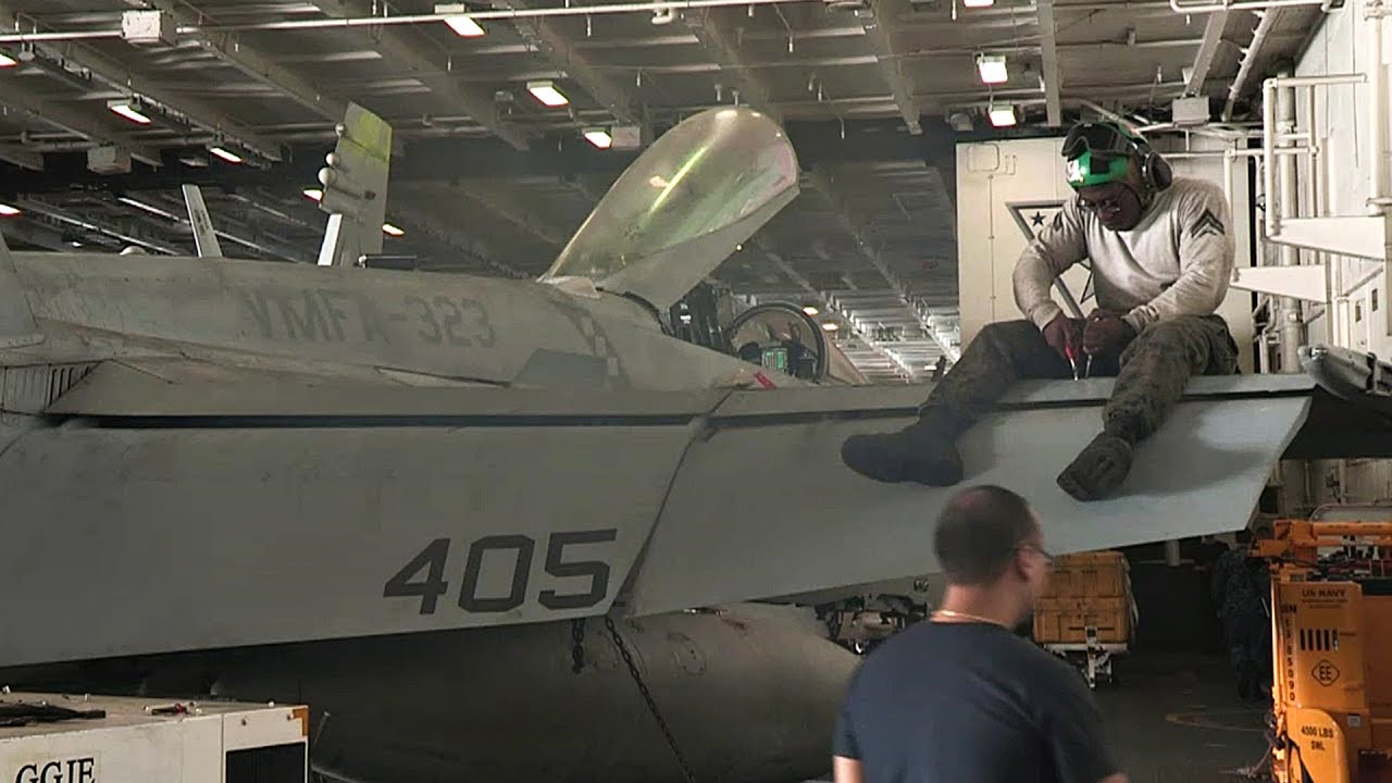 F/A-18 Hornet Maintenance Aboard Aircraft Carrier USS Nimitz