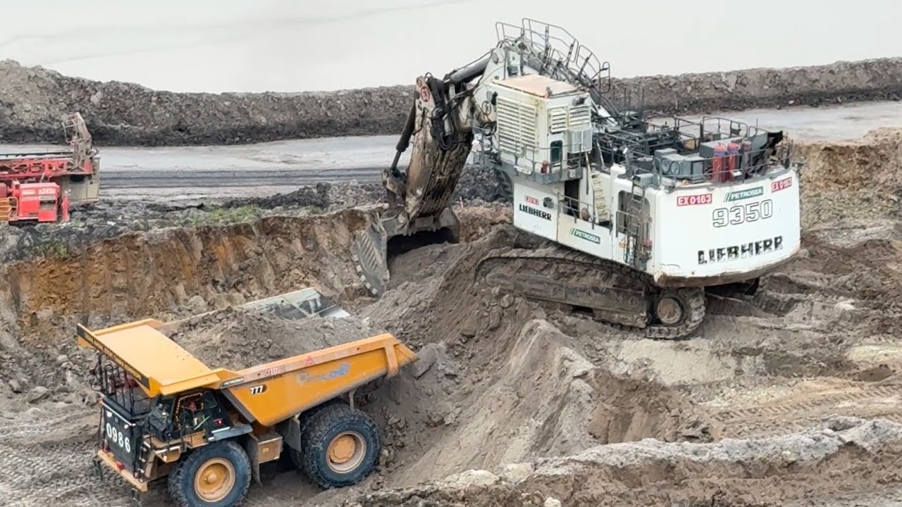I love this machine Liebherr R 9350 Excavator Loading Sand material on OHT CAT 777 kyd ~ miningstory