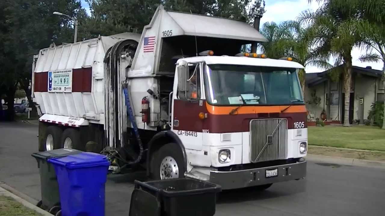 Two Maxon Automated Side Load Garbage Trucks