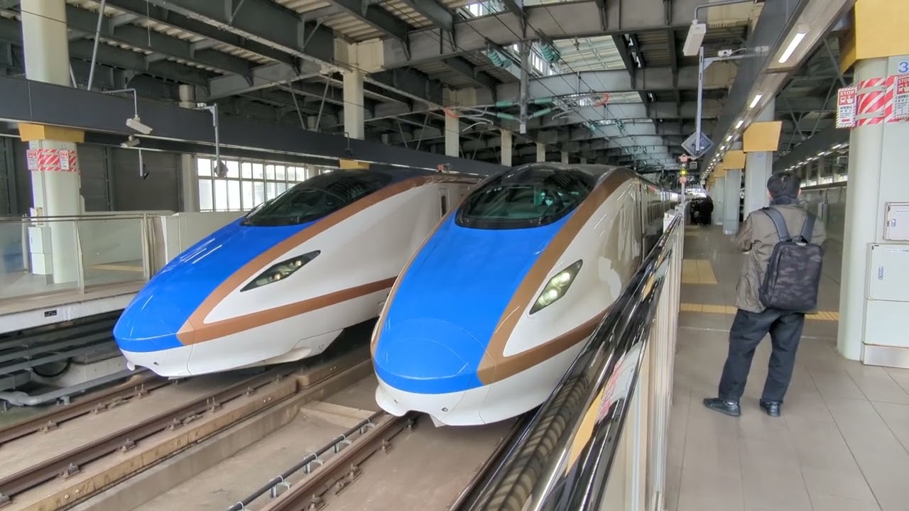 2026年3月14日北陸新幹線金沢(駅)12番のりば停車中 W7系W21編成運行12Eつるぎ12号→(回送列車)回送2201E 13番のりば着発 E7系F12編成運行3507Eかがやき507号