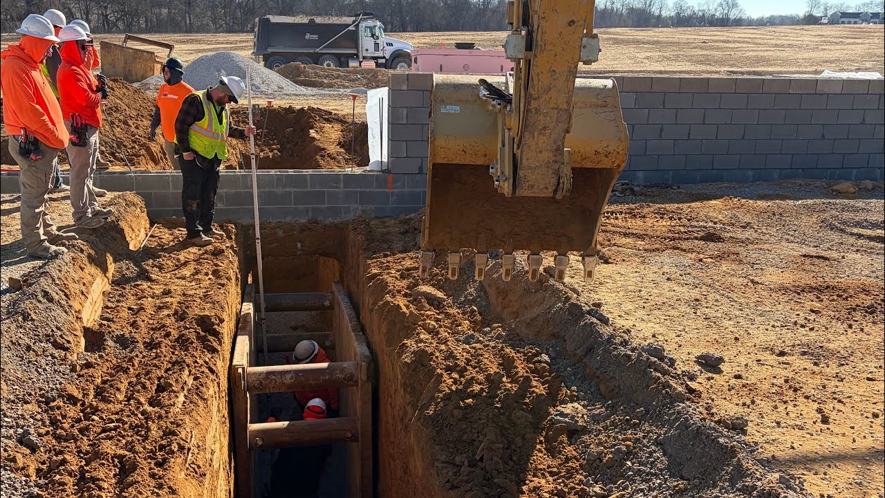 Digging plumbing for a Kroger’s with a CAT 313