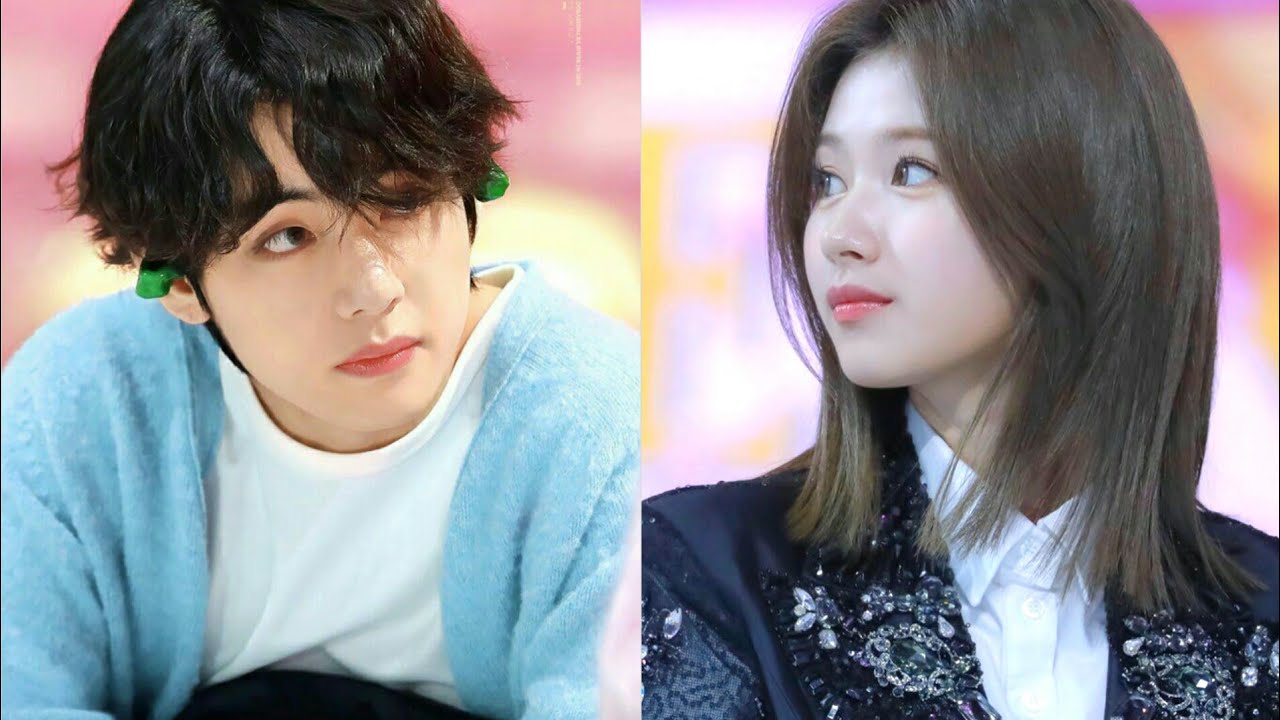 Taehyung & Sana glancing at each other