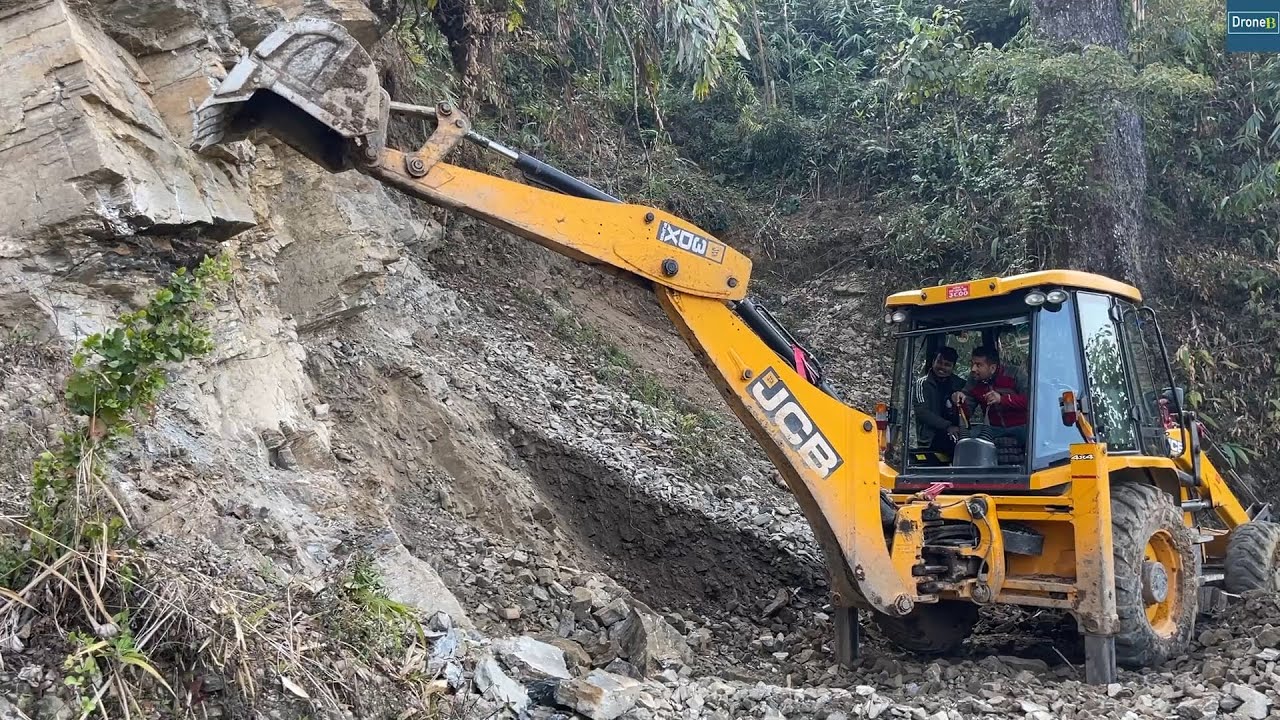 Opening Blocked Hilly Road to Supply Stones With Jcb Backhoe
