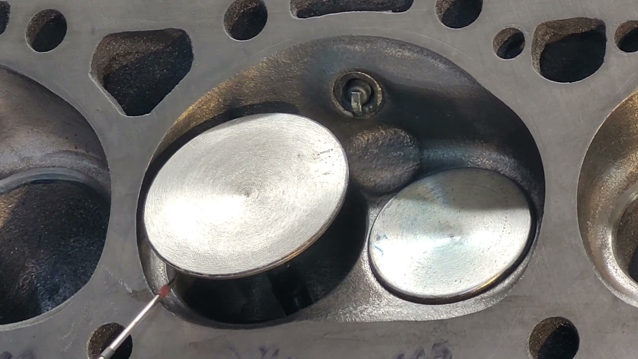 Ported Chevy Fuelie cylinder head 041x chamber air flow flag experiment