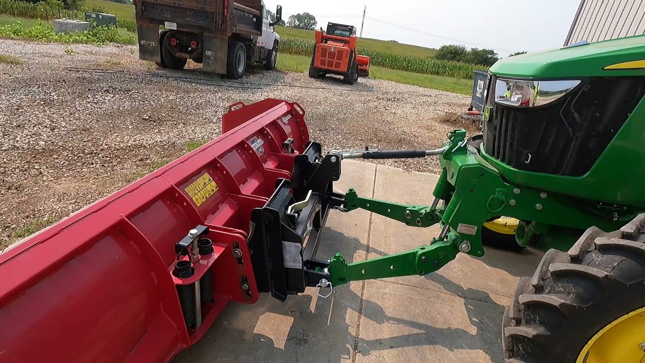 John Deere 5075E with a Snow Pusher. Skid Loader Killer
