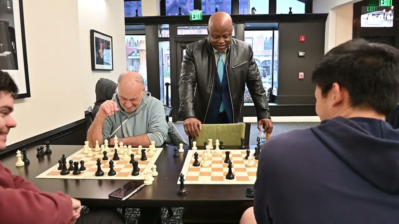 Maurice Ashley shows a chess study to Grandmasters at the St. Louis Chess Club
