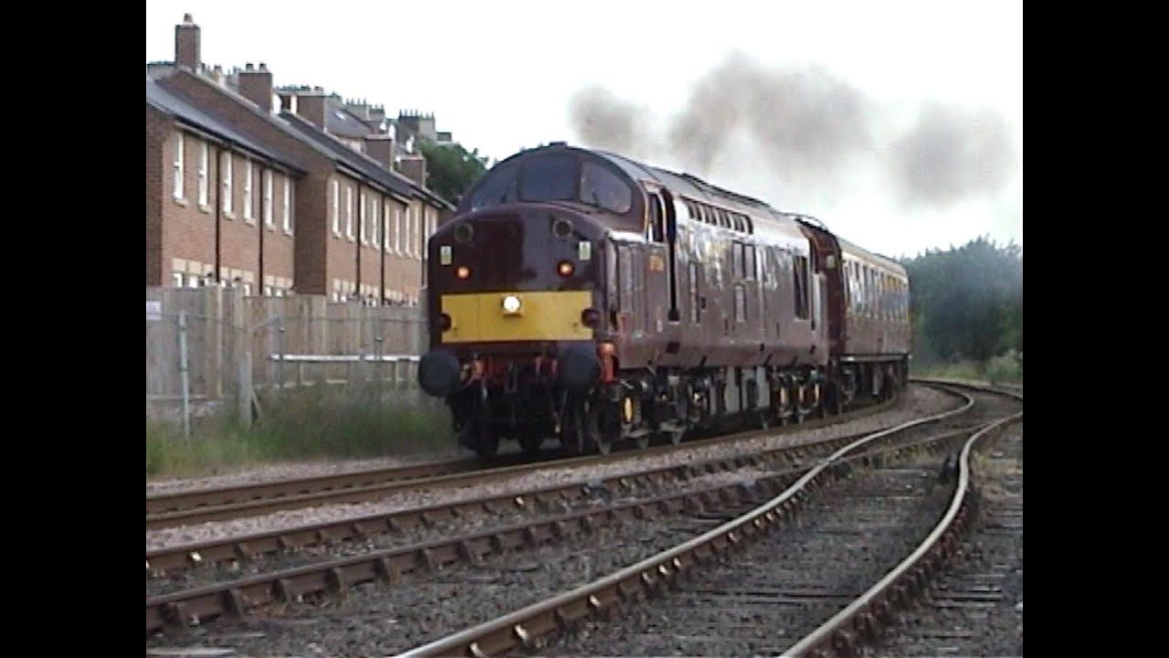 Class 37 516 with 10 coaches and a dead 47 departing Whitby, working flat-out on tour to Scotland.