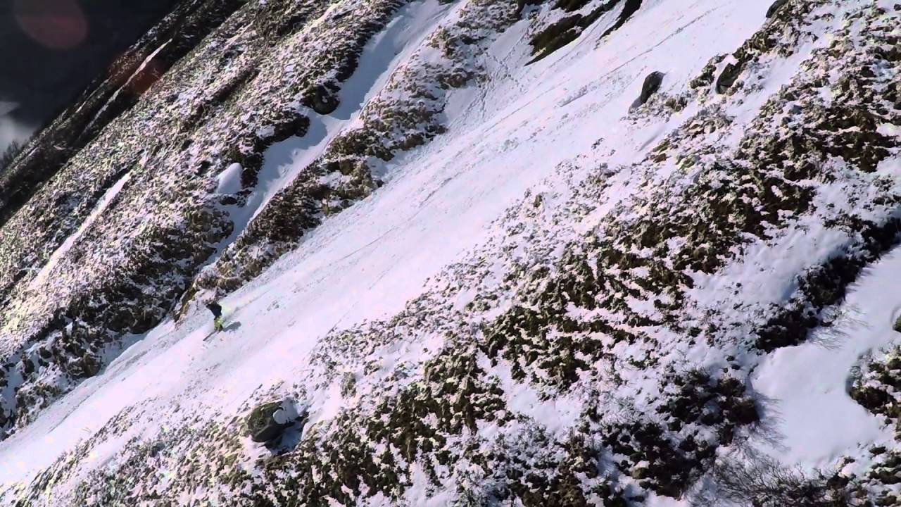 Telemark skiing in a steep couloir in Morfjorden, Norway