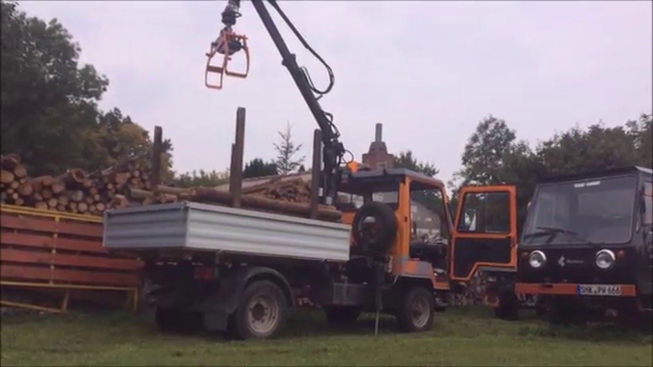 Holz Laden mit Multicar M25 Ladehilfe LDK 010 und Forstgreifer mit Rotor 3t