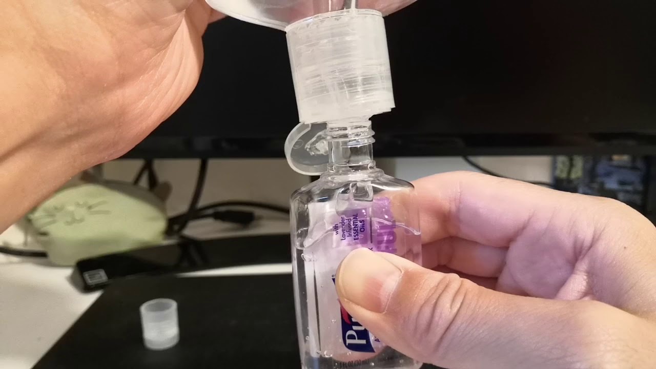 Refill small Purell hand sanitizer bottles without spilling or overflow from a large container
