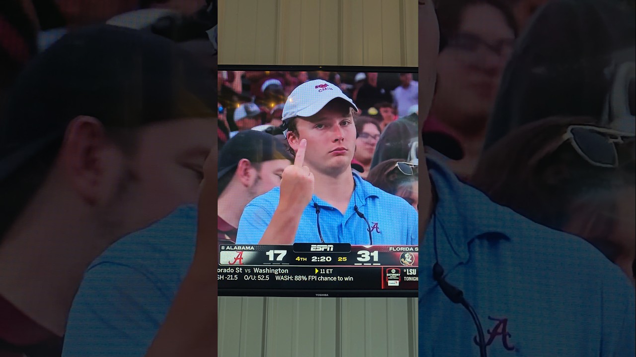 Alabama fan gives camera middle finger  