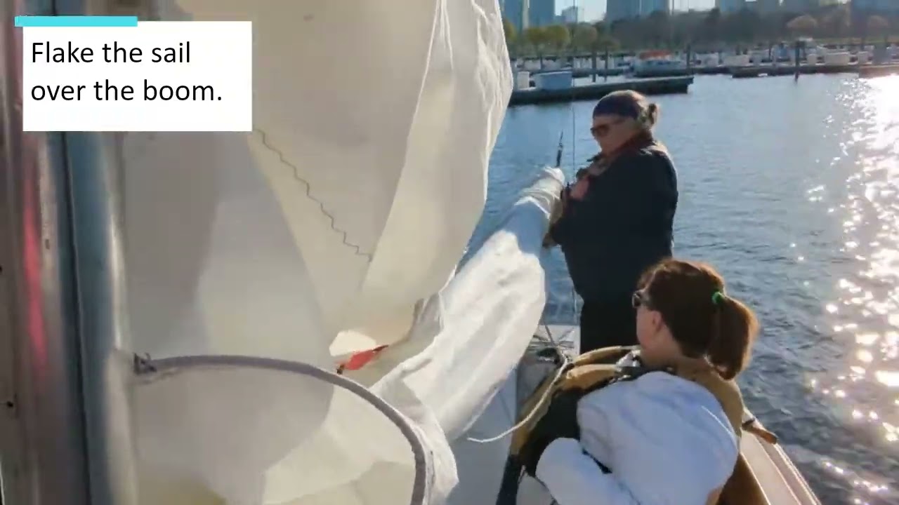 Flaking the Sail on the Ensign