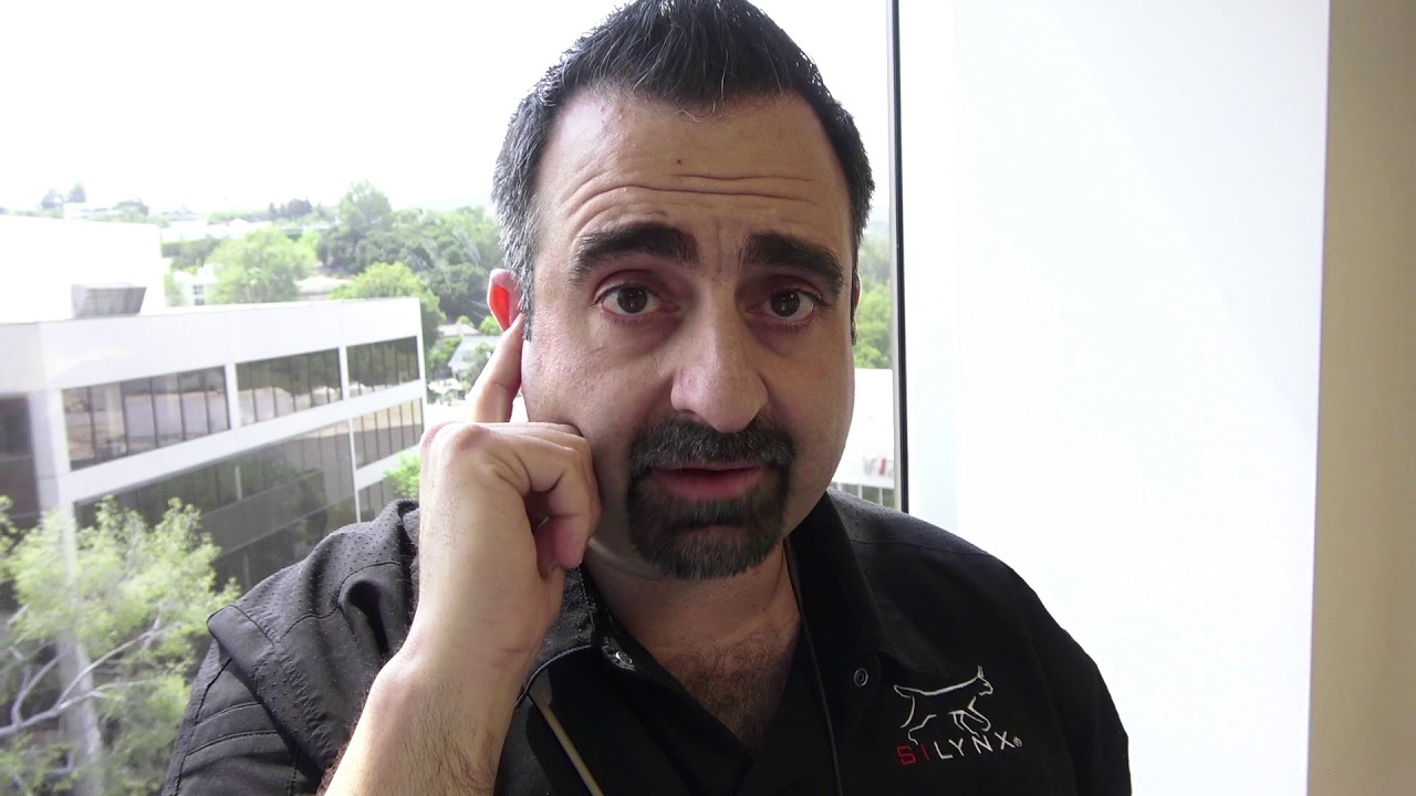 Donning a Silynx in-ear headset