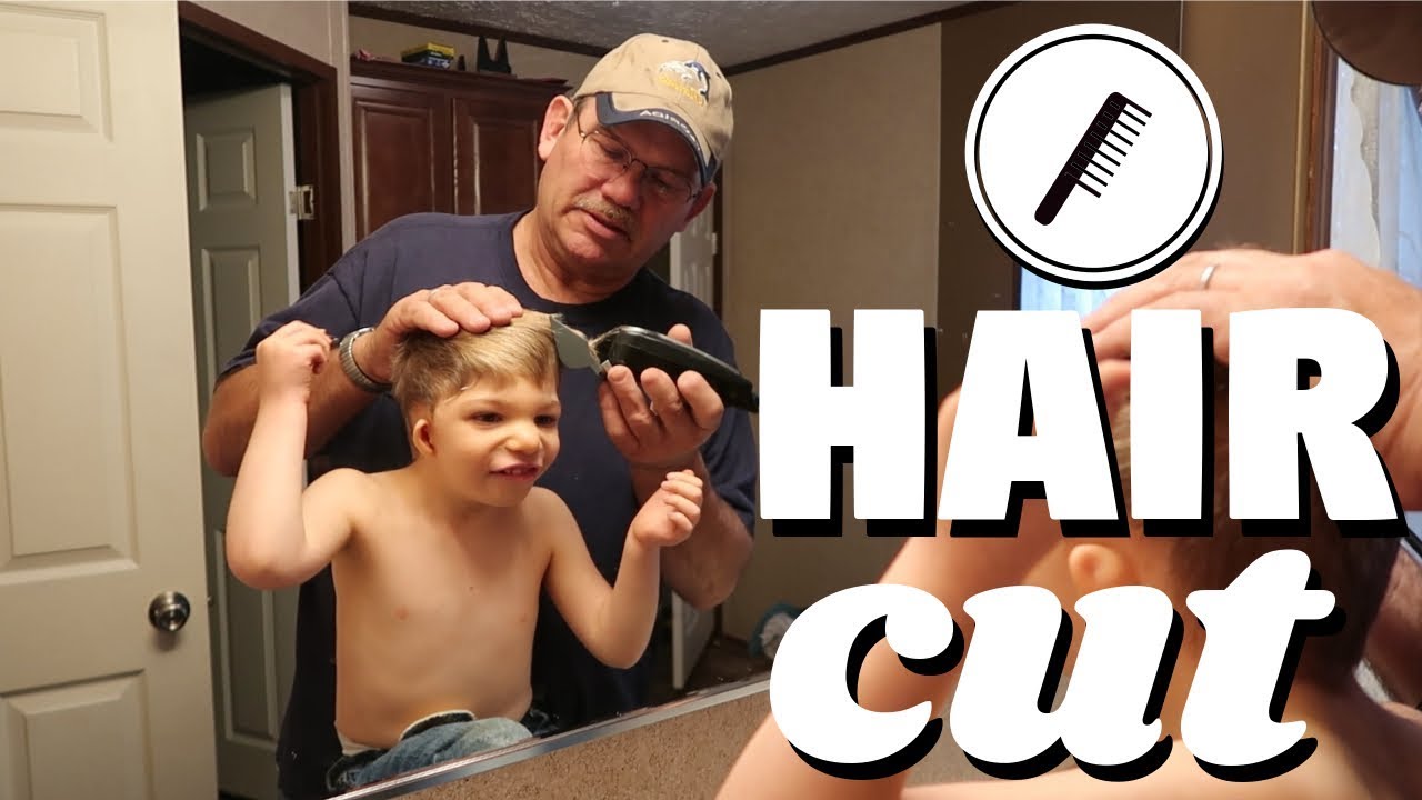 Toddler gets a haircut from papaw