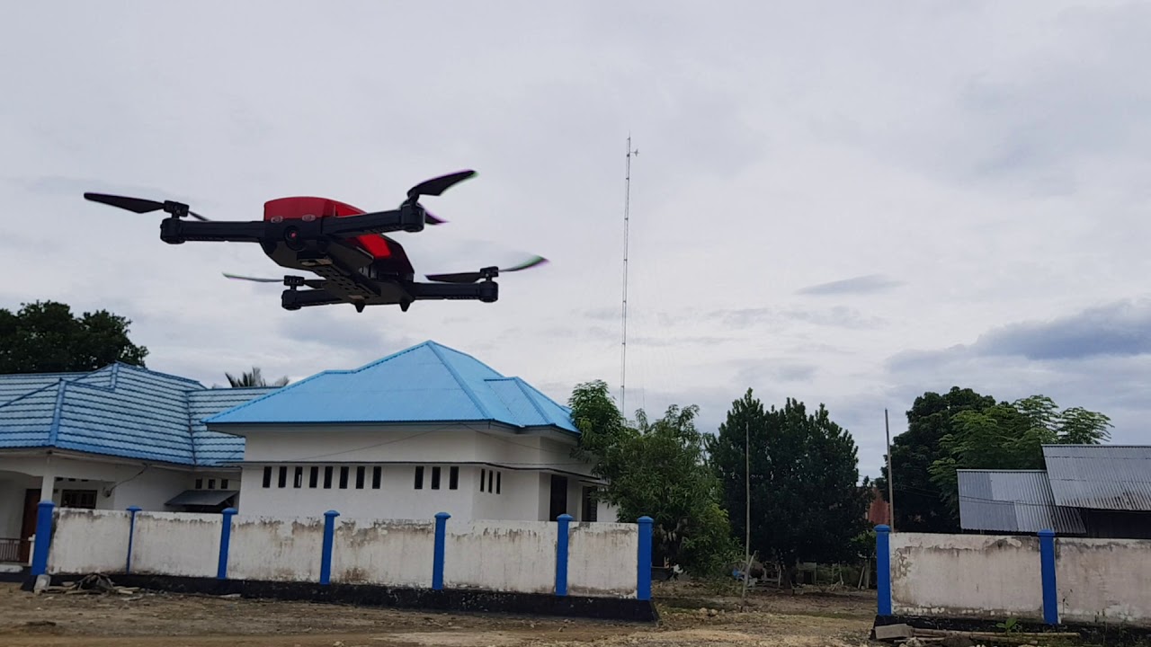 Playing Drone XK WLToys Q636-B Red at Backyard