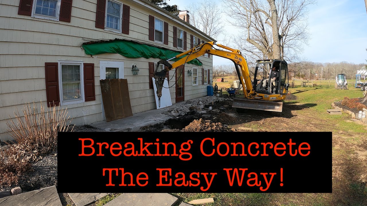 Mini Excavator Hammering Concrete