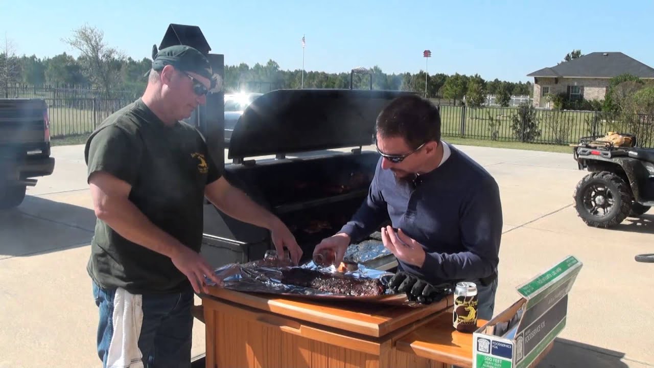 King of the Grill Gator Pit crew Cooking up Q