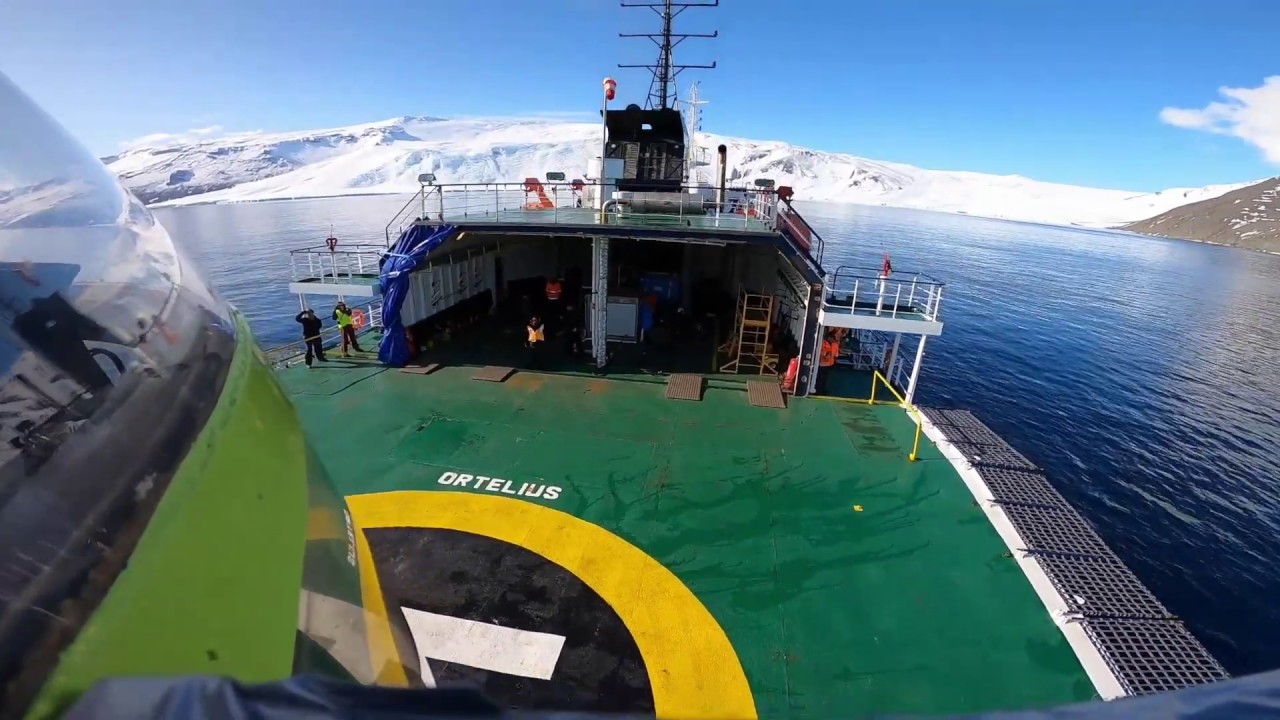 Epic Helicopter Flight in Antarctica over glaciers and snow covered mountains, Ross Sea