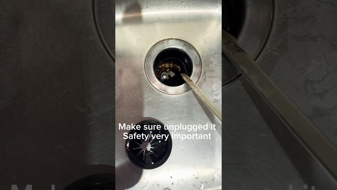 How to fix the GE garbage disposal not working, using long screw driver very easy