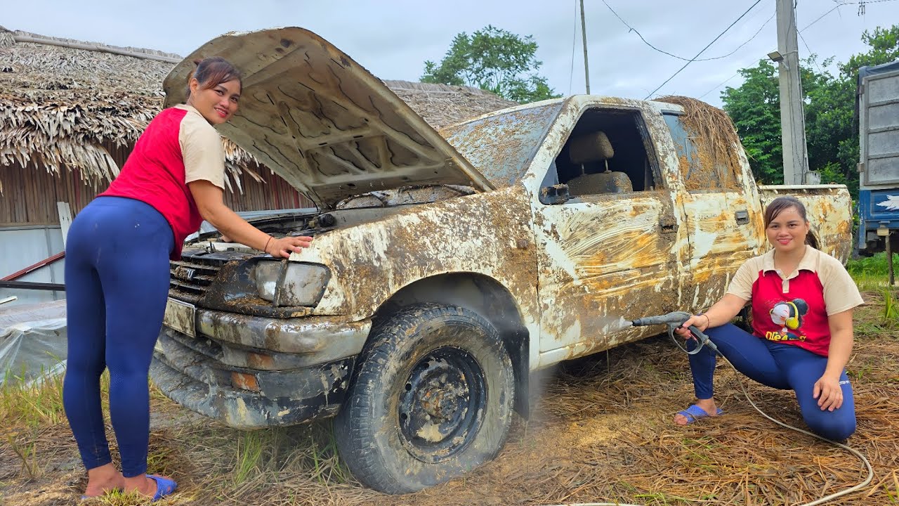 The girl repairs and restores an old scrap pickup truck that was heavily flooded.
