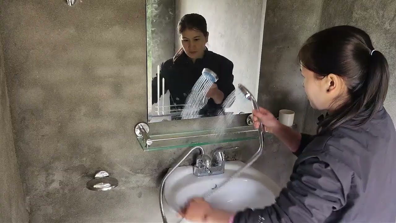 The single woman finished the bathroom and put it into use