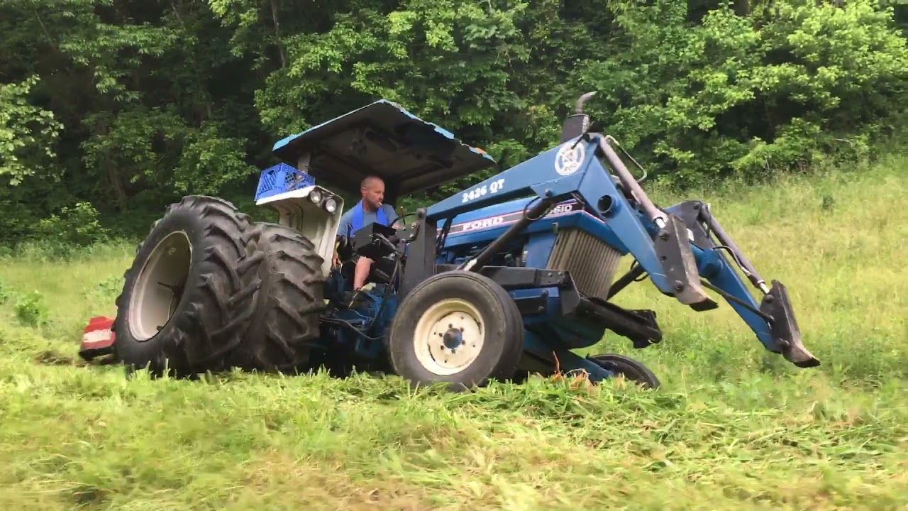 Extreme bush hogging steep ground on a rear wheel drive tractor
