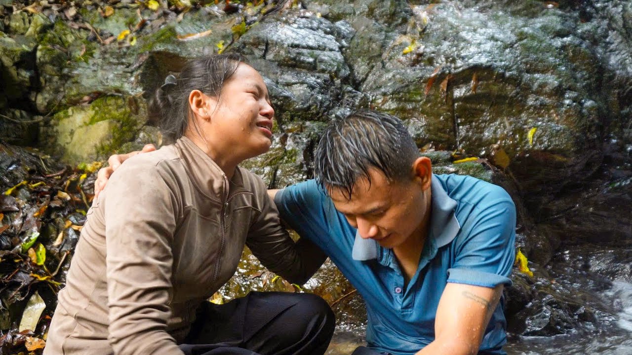 The wife burst into tears when she found her husband at the bottom of the waterfall.