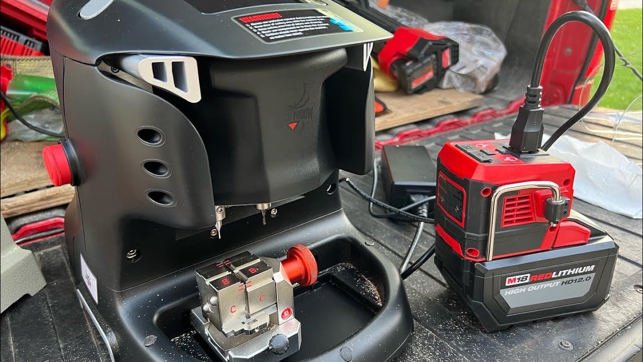 Black Widow key machine running off a Milwaukee Tool M18 power source inverter.
