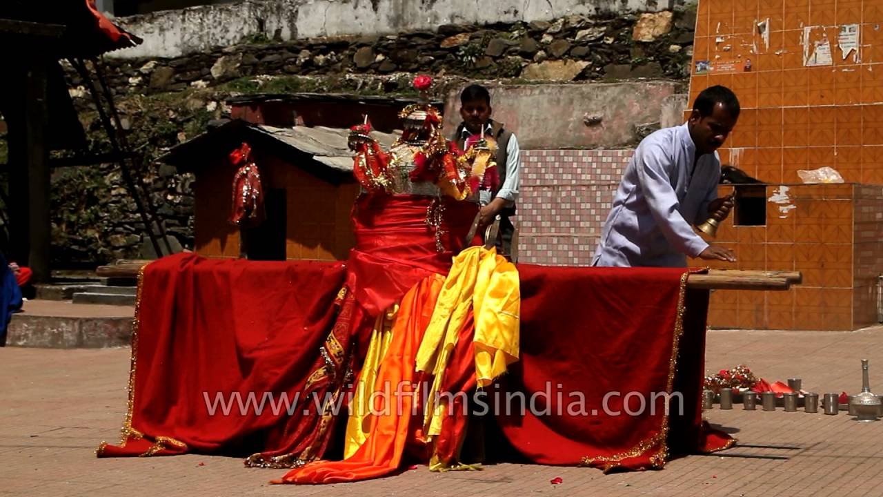 Garhwali man worships Goddess Annapurna's palanquin at a temple, Uttarakhand