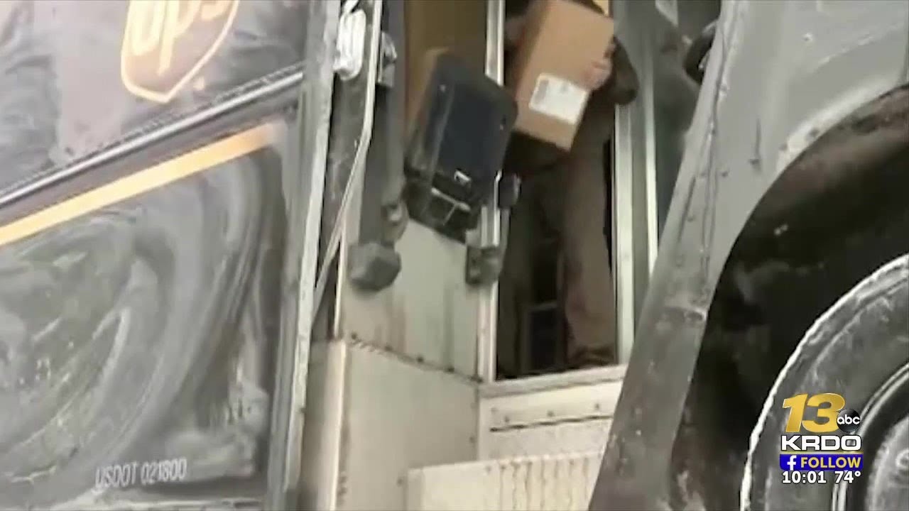 Suspects escape after punching UPS driver and stealing packages